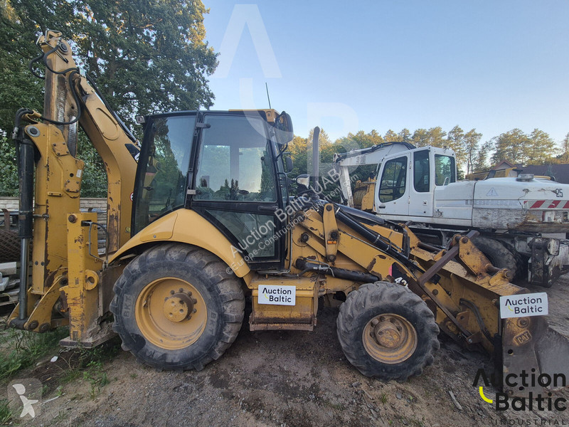 Екскаватор навантажувач Caterpillar