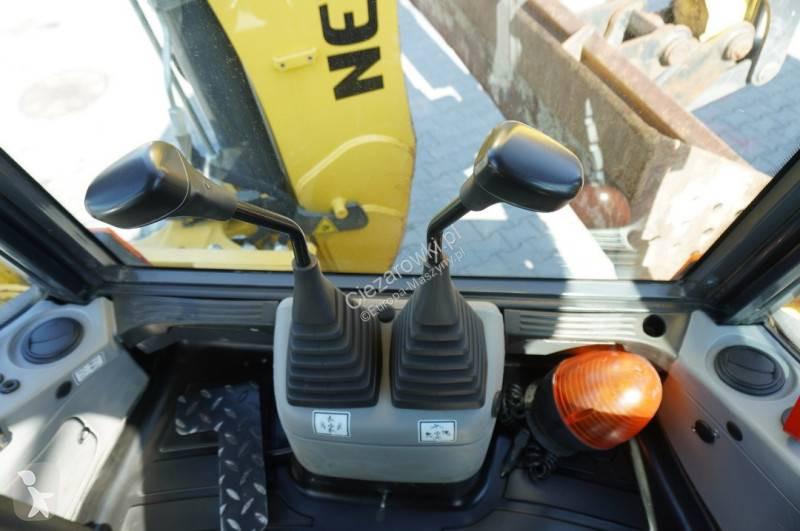Bagr New Holland B 115 C backhoe loader / 1000...
