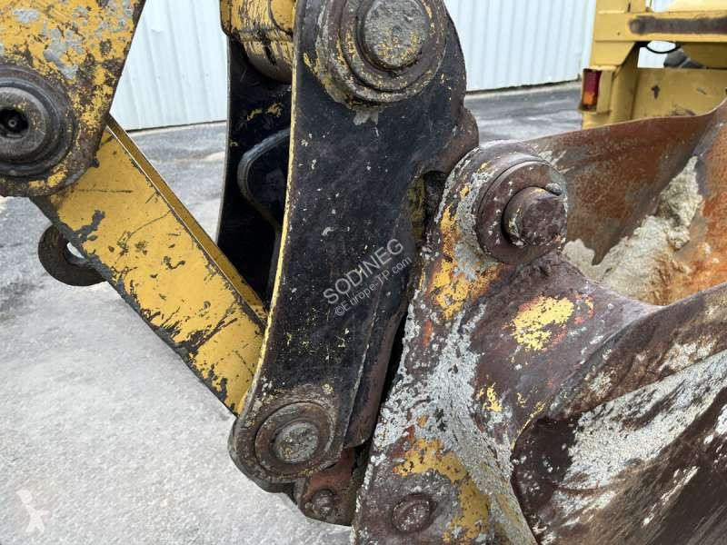 Traktor med grab Caterpillar