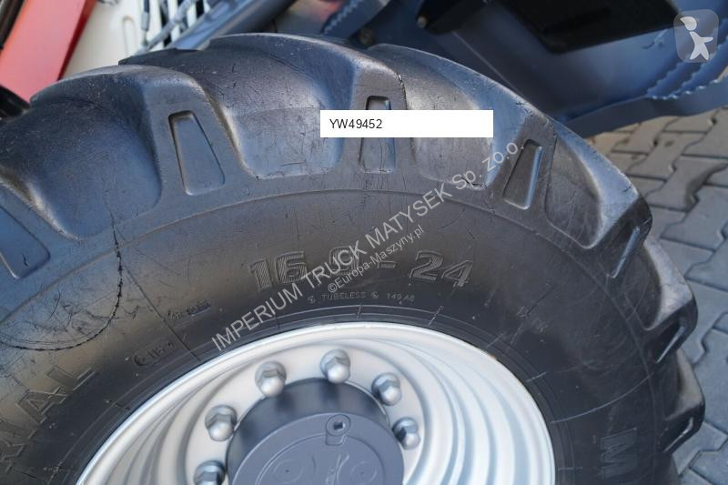 Traktor med grab Terex TLB 990