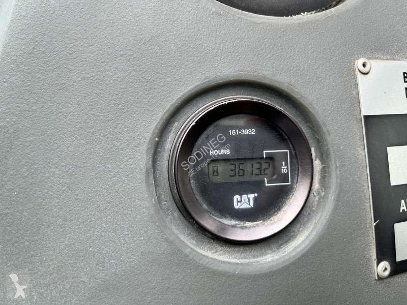 Traktor med grab Caterpillar
