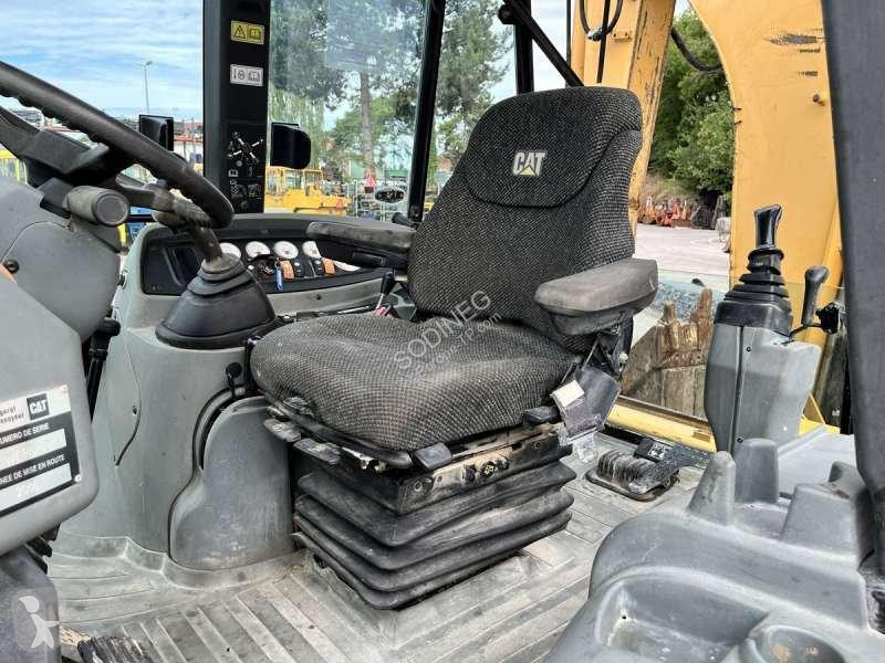 Traktor med grab Caterpillar