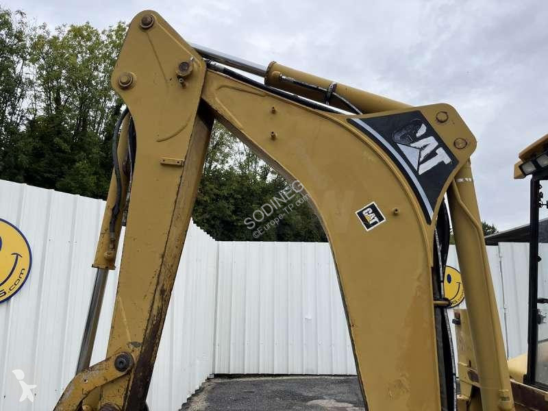 Traktor med grab Caterpillar