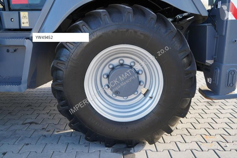 Traktor med grab Terex TLB 990