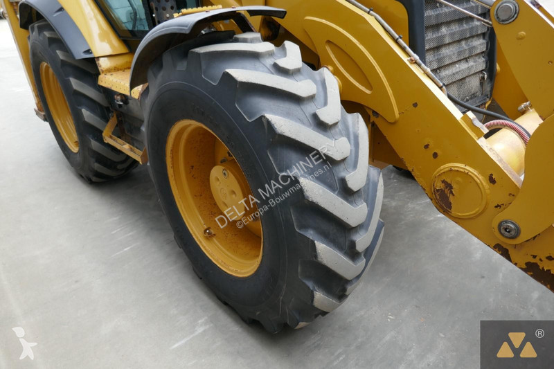 Traktor med grab Caterpillar 444F