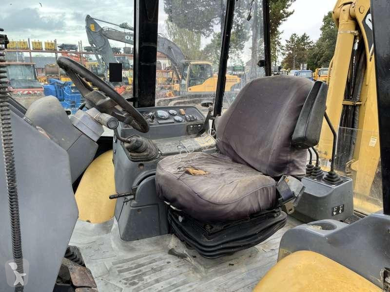 Traktor med grab Caterpillar