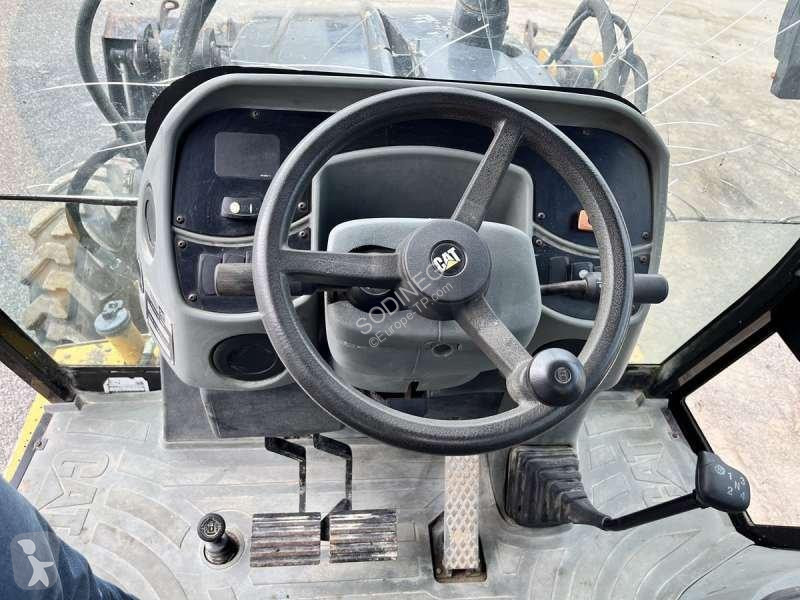 Traktor med grab Caterpillar