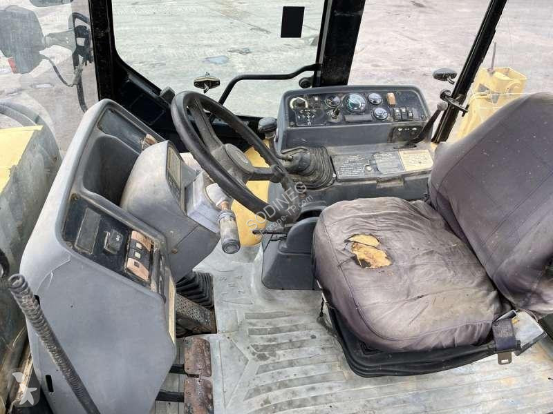 Traktor med grab Caterpillar