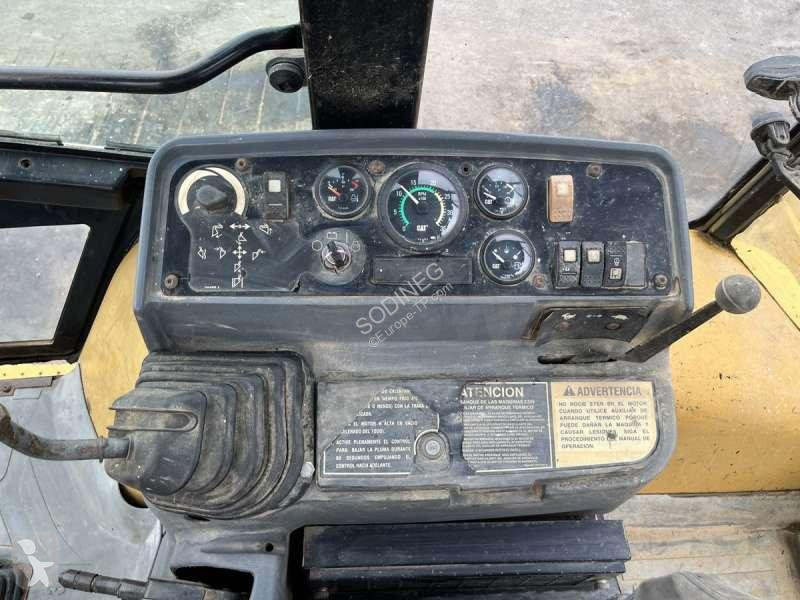 Traktor med grab Caterpillar