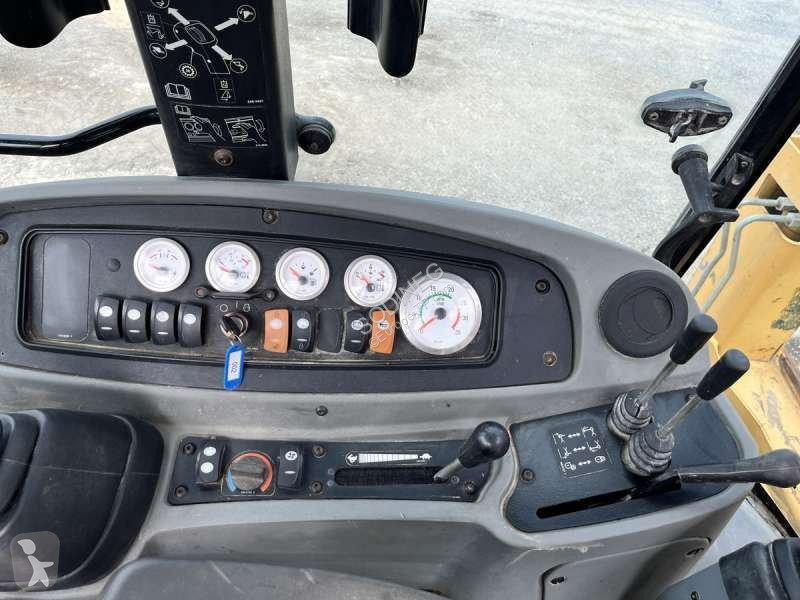 Traktor med grab Caterpillar