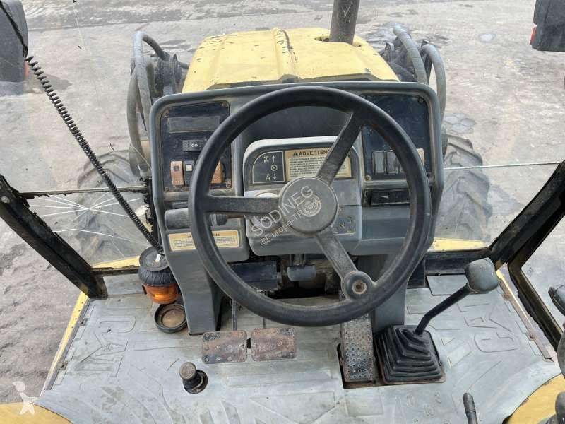 Traktor med grab Caterpillar