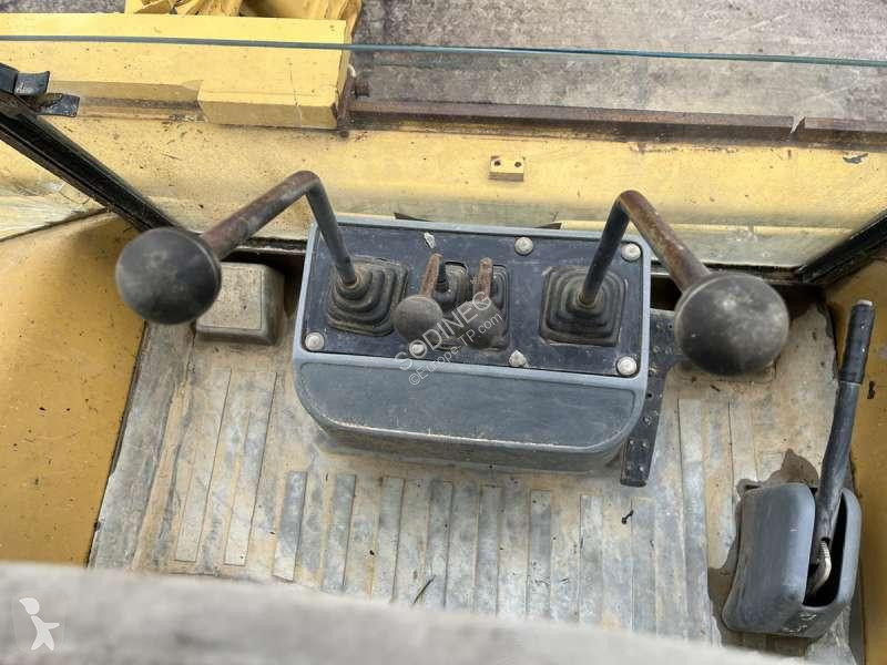 Traktor med grab Caterpillar