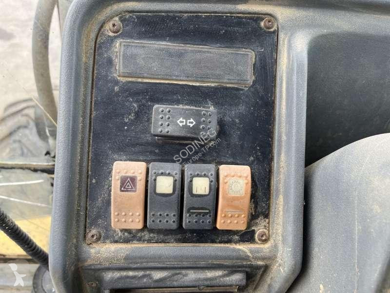 Traktor med grab Caterpillar