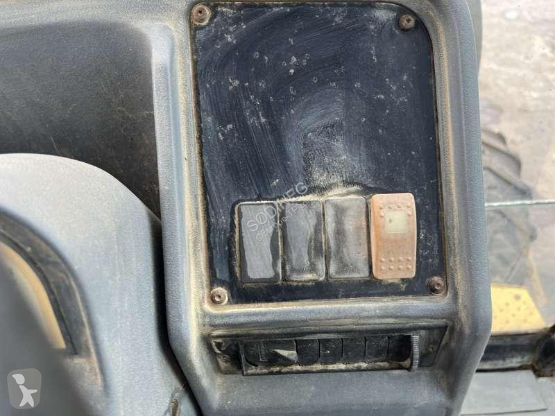 Traktor med grab Caterpillar