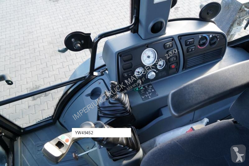 Traktor med grab Terex TLB 990