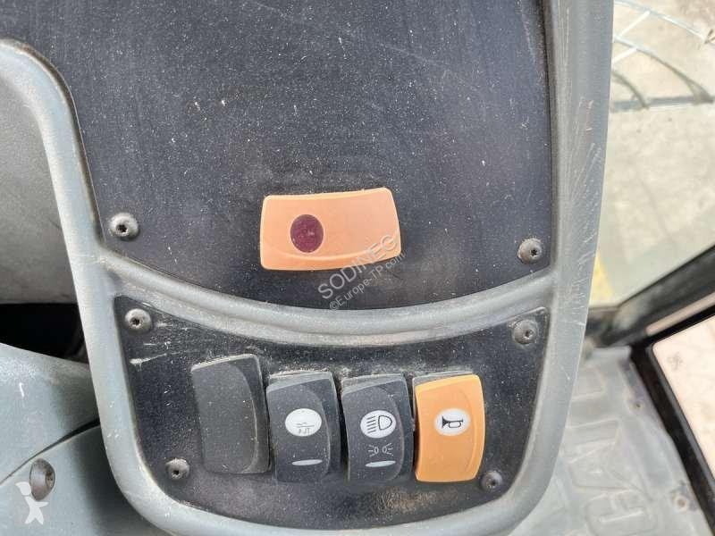 Traktor med grab Caterpillar