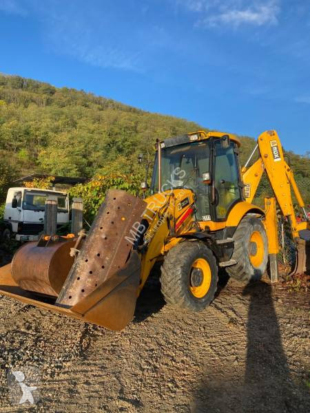 Traktor med grab JCB