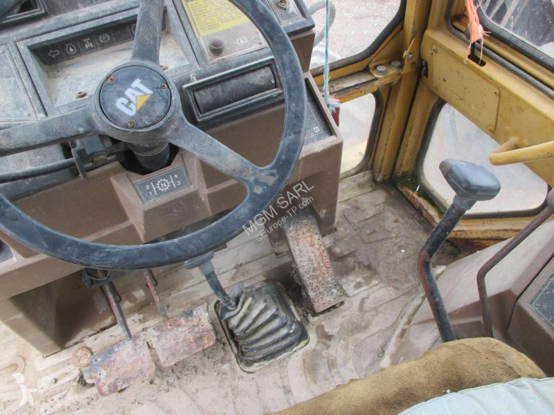 Traktor med grab Caterpillar