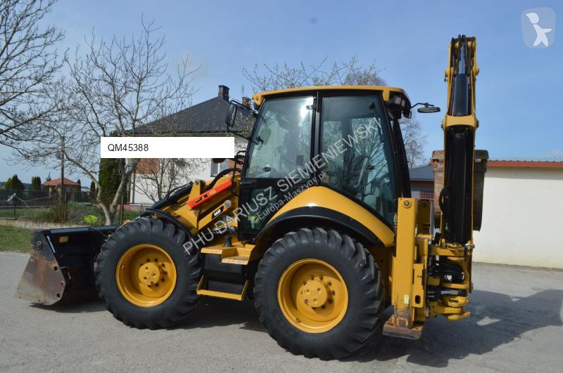 Traktor med grab Caterpillar 444F
