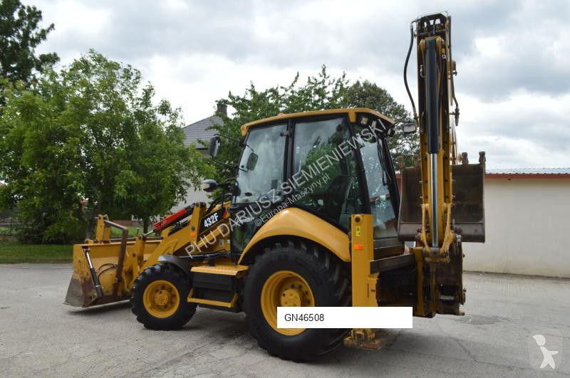 Traktor med grab Caterpillar