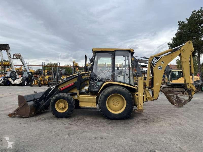 Traktor med grab Caterpillar