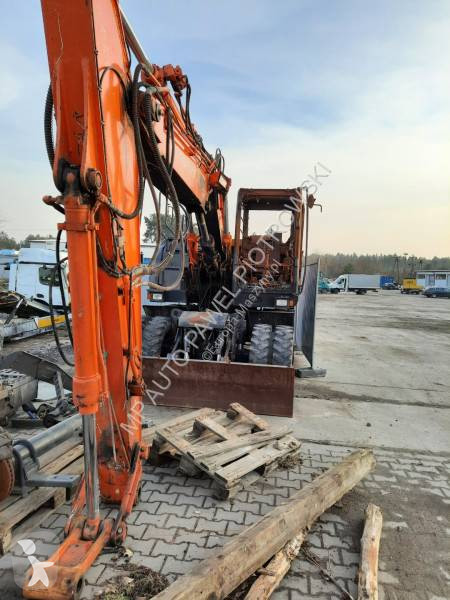 Traktor med grab Hitachi ZX210W-3