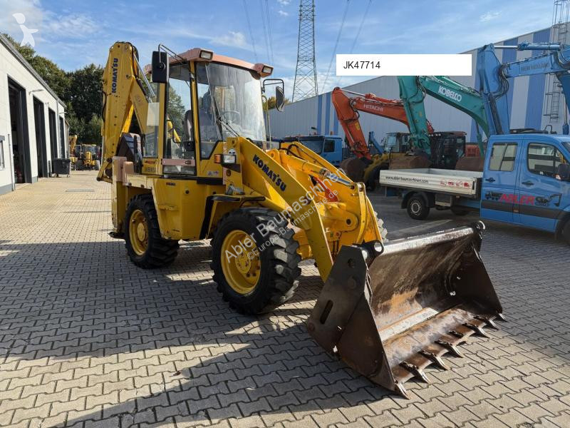 Traktor med grab Komatsu