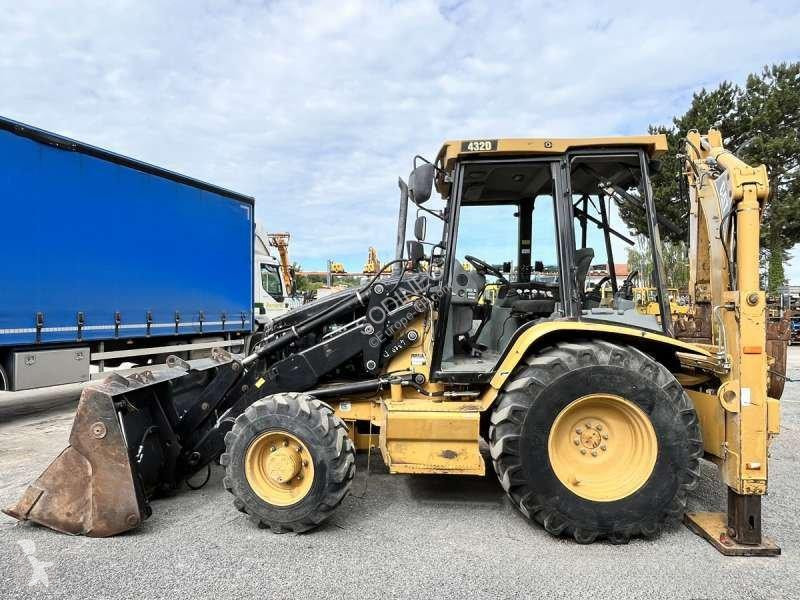 Traktor med grab Caterpillar