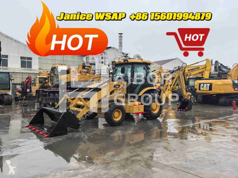 Traktor med grab Caterpillar