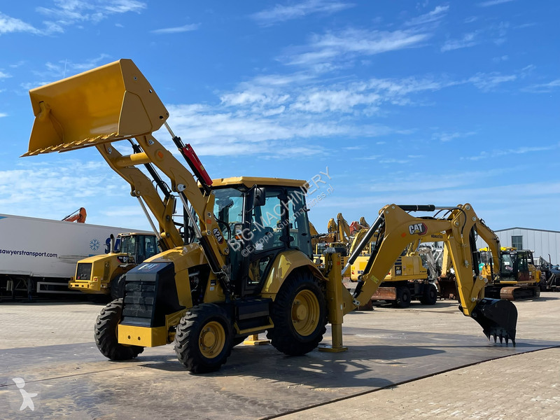 Traktor med grab Caterpillar 424