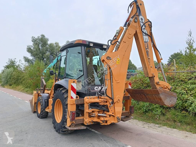 Traktor med grab Case backhoe loader graaf laad...