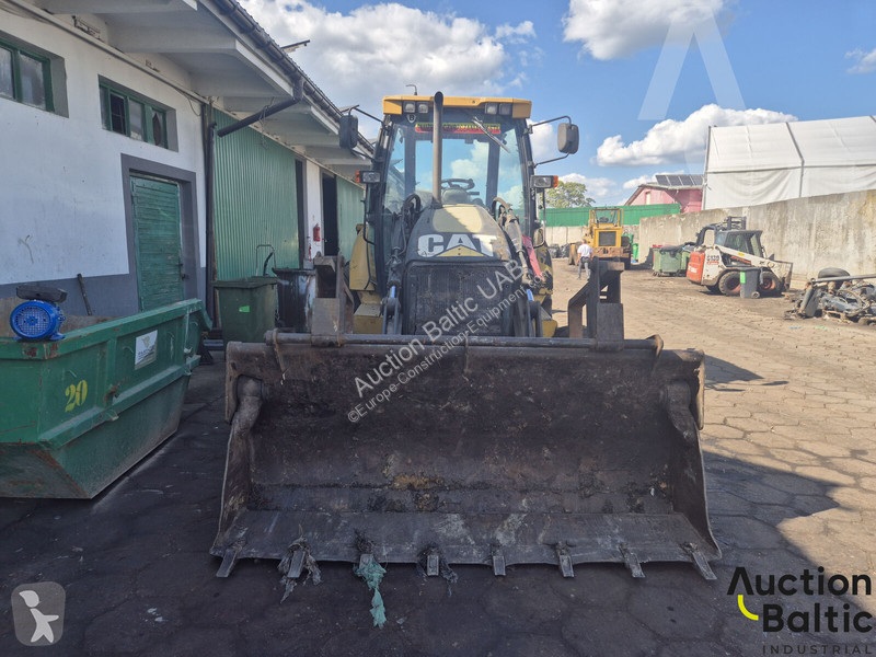Екскаватор навантажувач Caterpillar