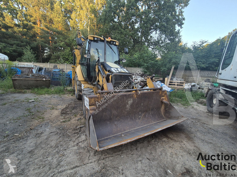 Екскаватор навантажувач Caterpillar