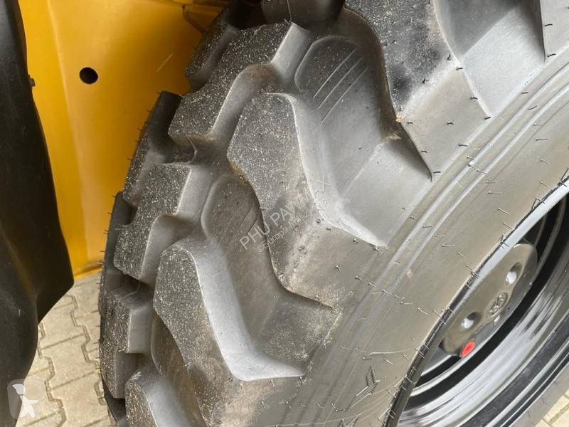 Traktor med grab Caterpillar 444 F2