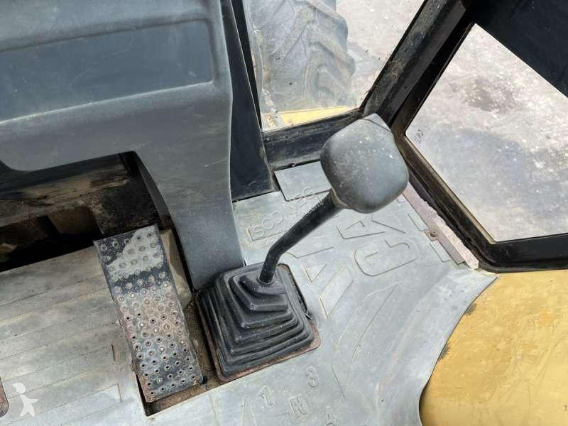 Traktor med grab Caterpillar