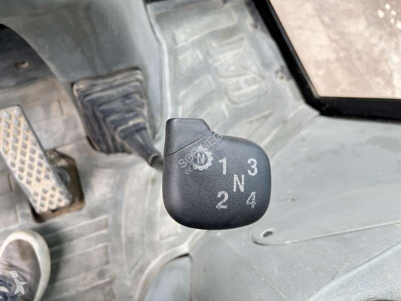 Traktor med grab Caterpillar