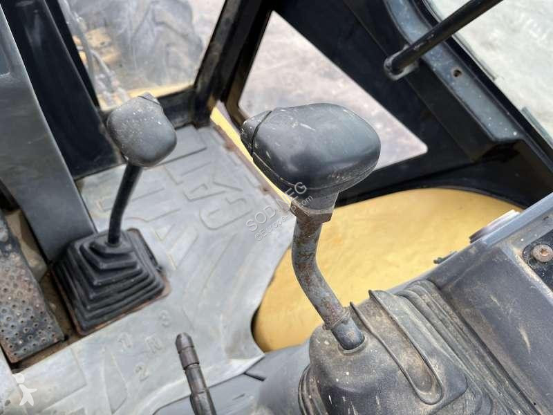 Traktor med grab Caterpillar
