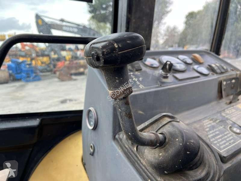 Traktor med grab Caterpillar