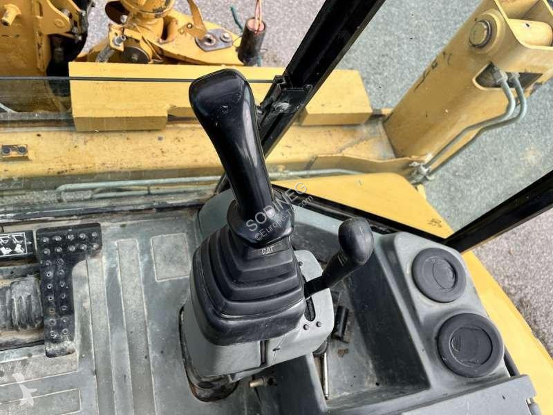 Traktor med grab Caterpillar