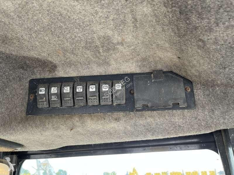 Traktor med grab Caterpillar