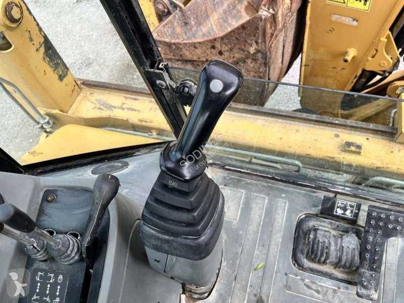 Traktor med grab Caterpillar