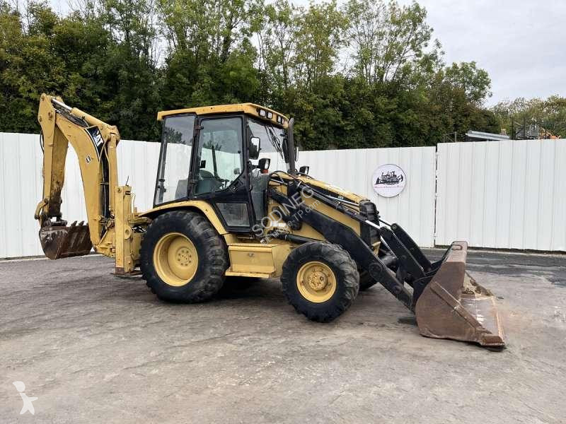 Traktor med grab Caterpillar