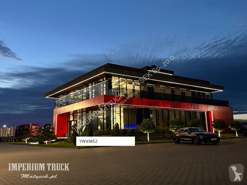 Traktor med grab Terex TLB 990