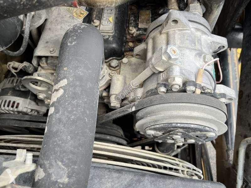 Traktor med grab Caterpillar