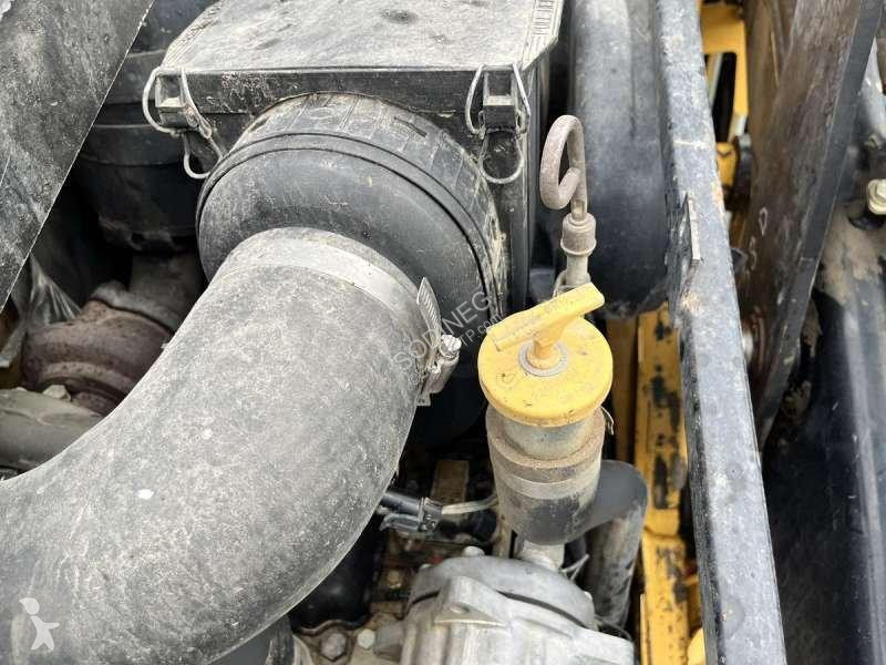 Traktor med grab Caterpillar