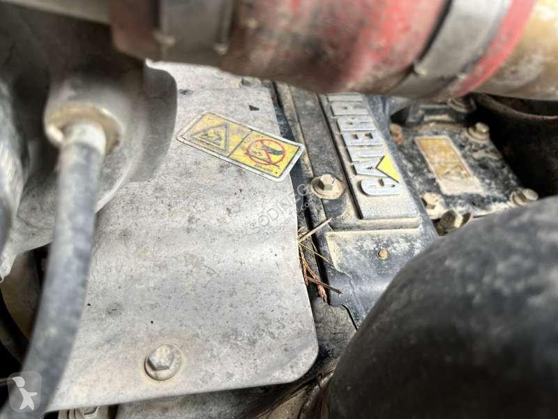 Traktor med grab Caterpillar