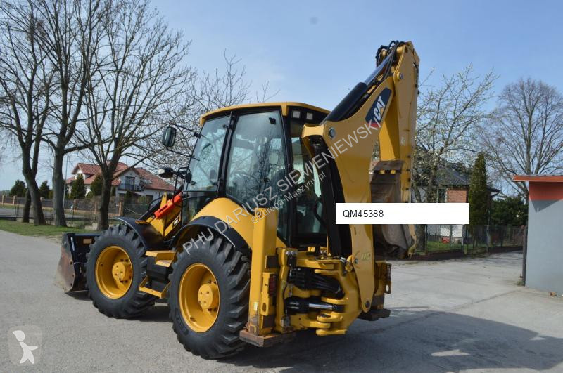 Traktor med grab Caterpillar 444F