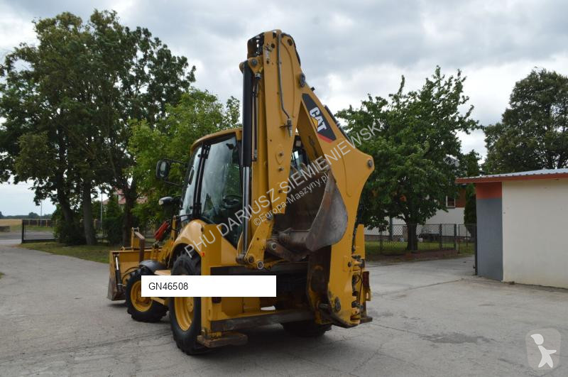 Traktor med grab Caterpillar
