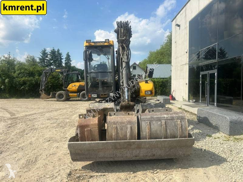 Traktor med grab Mecalac 12 MTX...