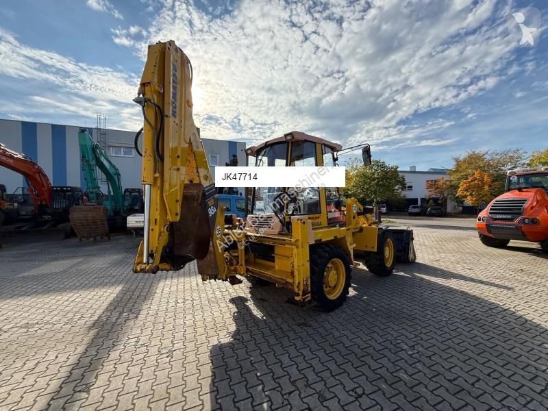 Traktor med grab Komatsu